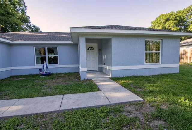 front view of a house with a yard