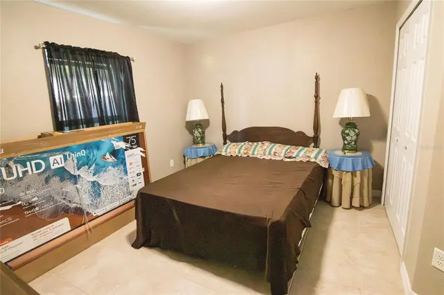 a bedroom with a bed and a dresser