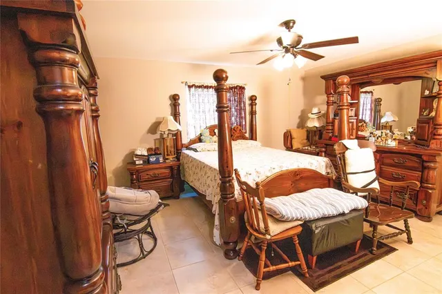 a bedroom with furniture and a chandelier