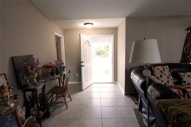 a view of a entryway with furniture and rug