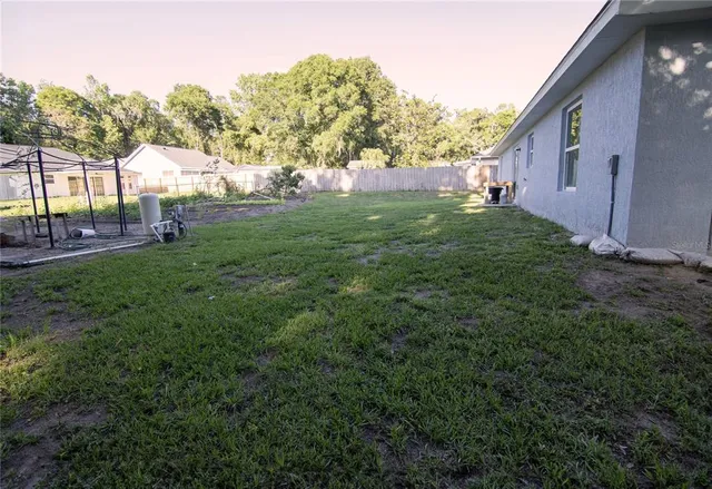a view of backyard with green space