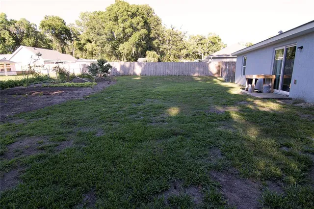 a view of backyard with outdoor seating