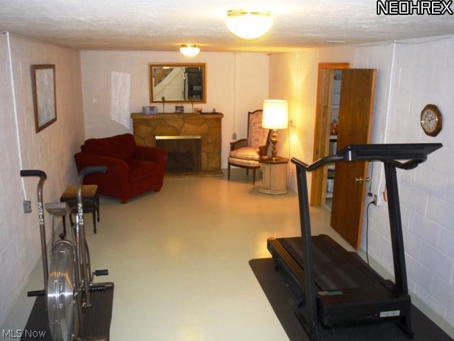 3760 Baird Road Stow, OH 44224 - Photo 18 of 25 view of partially finished basement. Artificial fireplace.