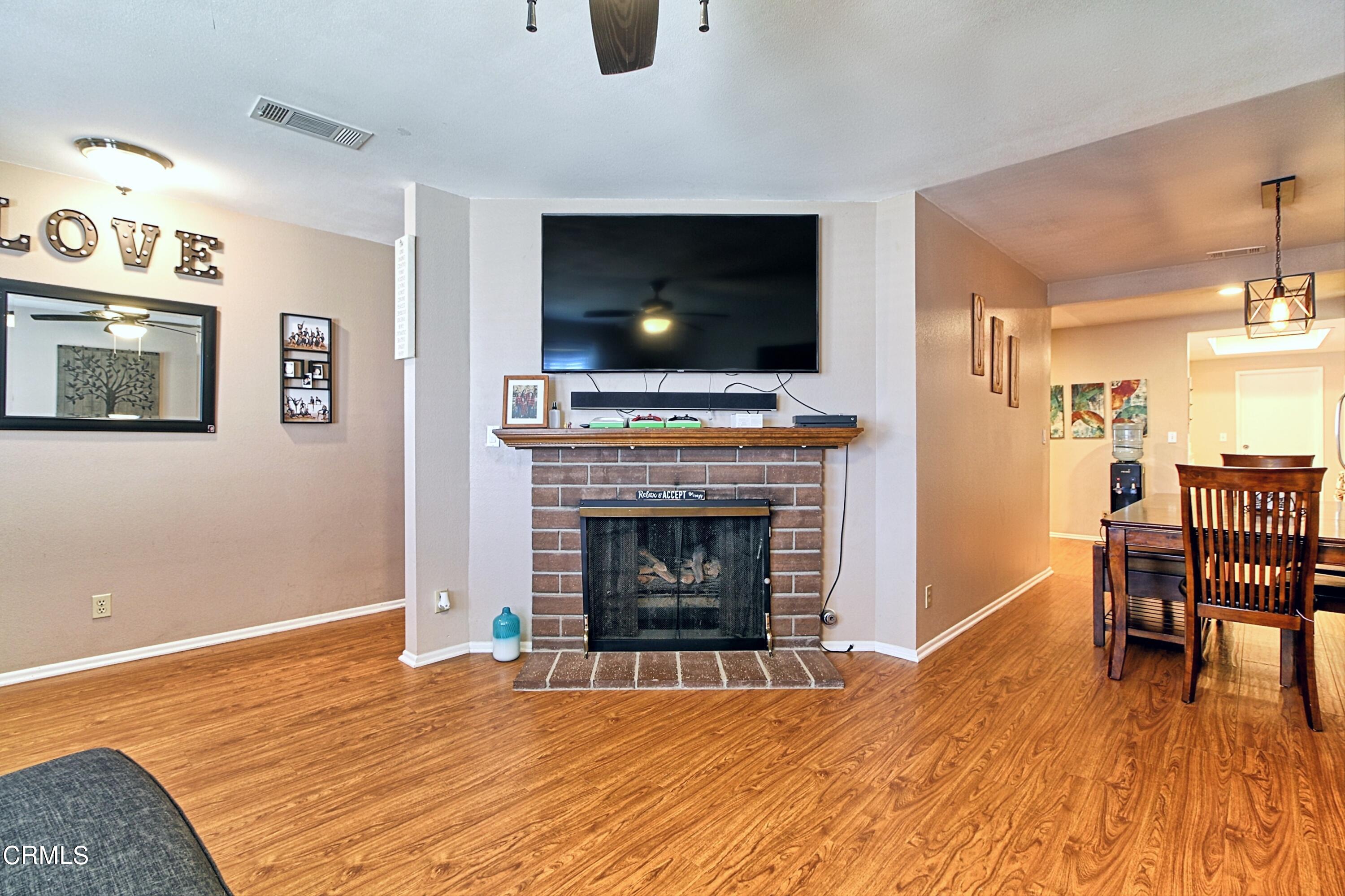1801 Masthead Drive Oxnard, CA 93035 - Photo 14 of 27 a living room with furniture a flat screen tv and a fireplace