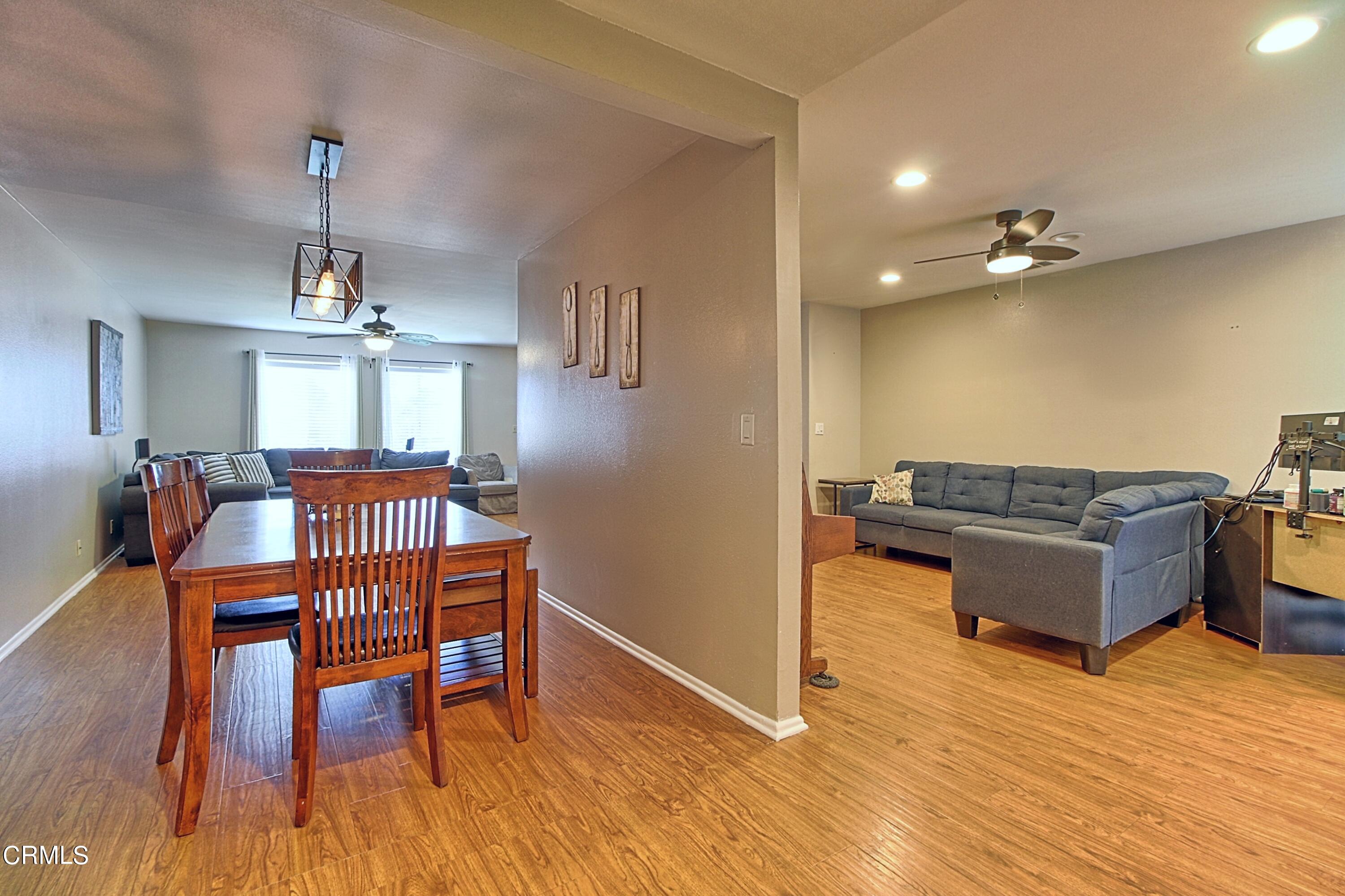 1801 Masthead Drive Oxnard, CA 93035 - Photo 16 of 27 a living room with furniture dining table and a wooden floor
