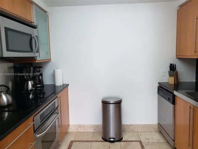 a kitchen with a stove and a microwave