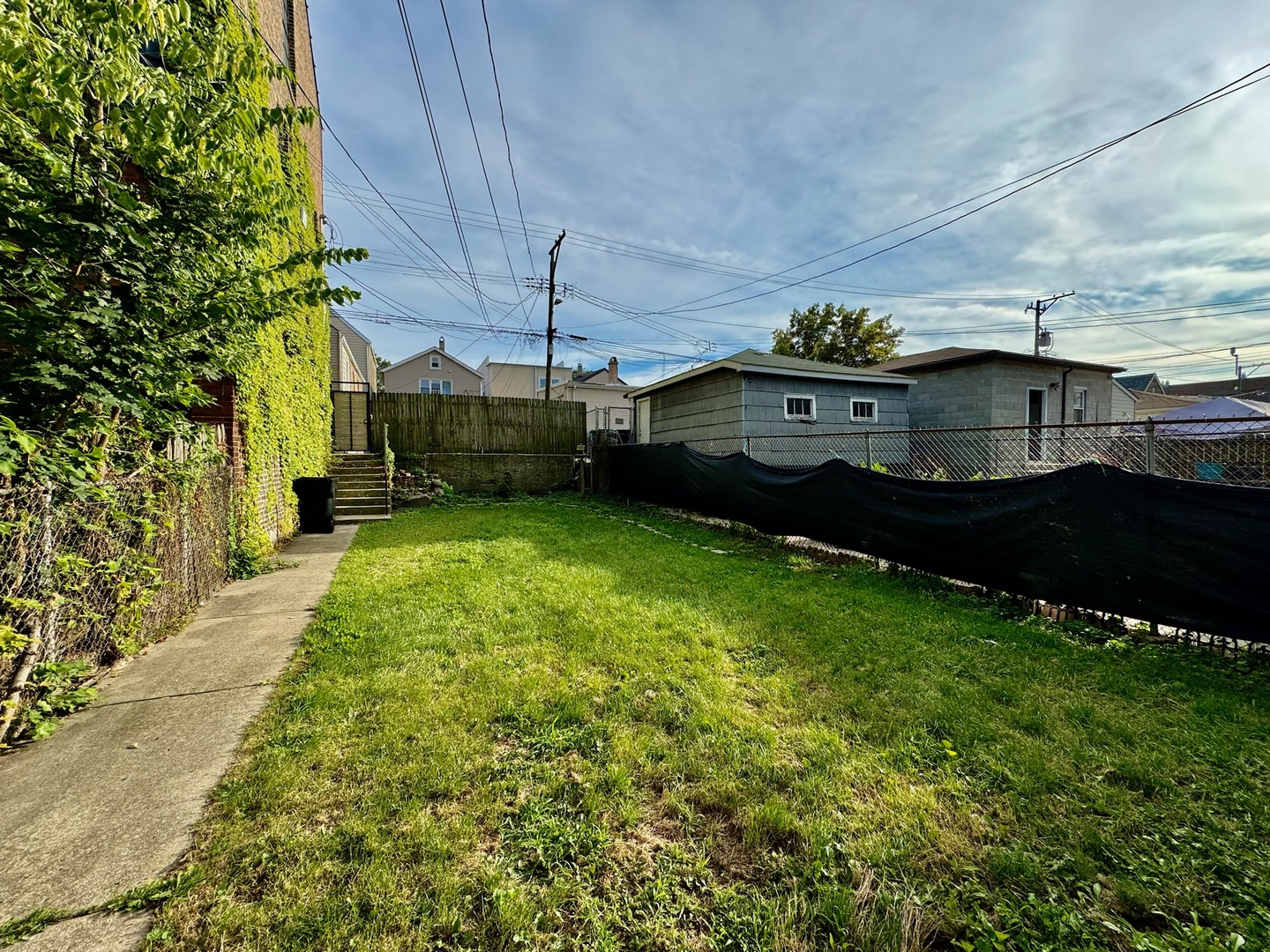 2011 West 22nd Place, Unit 1 Chicago, IL 60608 - Photo 13 of 13 a view of a big yard next to a house