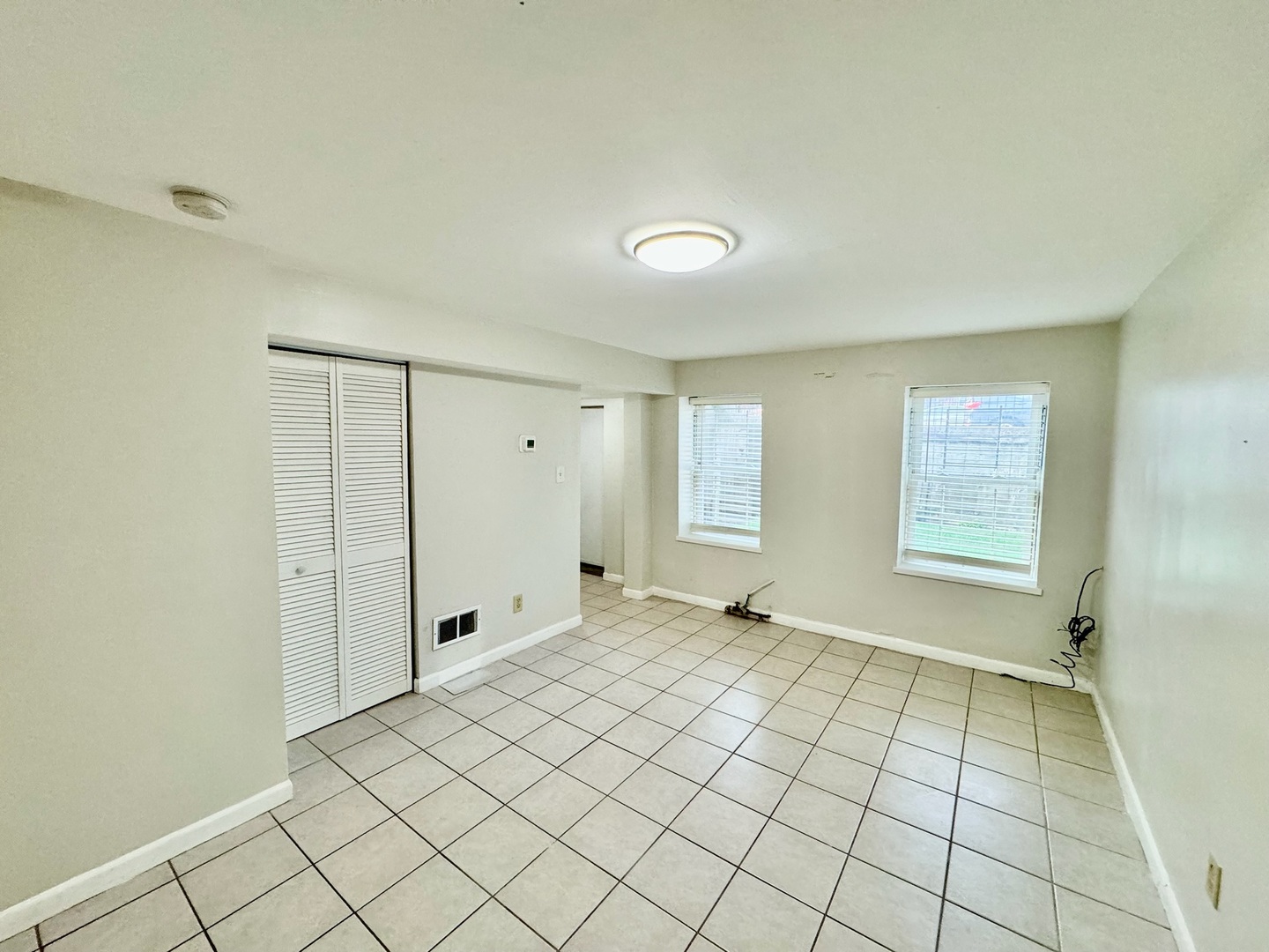 2011 West 22nd Place, Unit 1 Chicago, IL 60608 - Photo 3 of 13 a view of an empty room and window