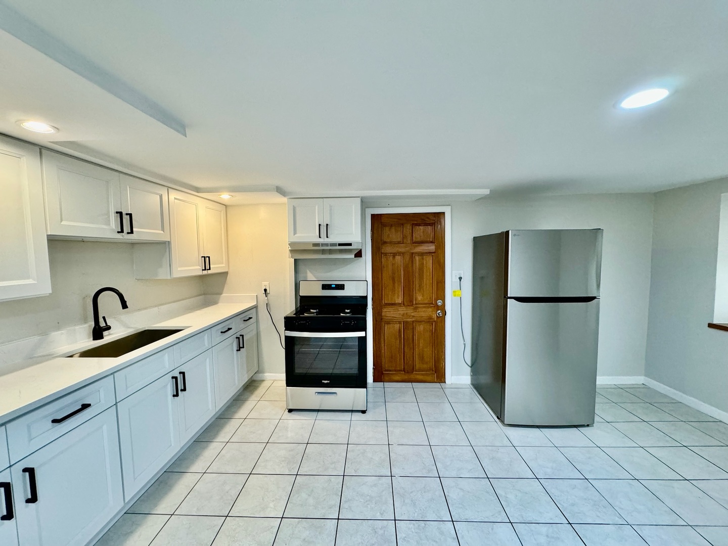 2011 West 22nd Place, Unit 1 Chicago, IL 60608 - Photo 6 of 13 a kitchen with a refrigerator and a sink
