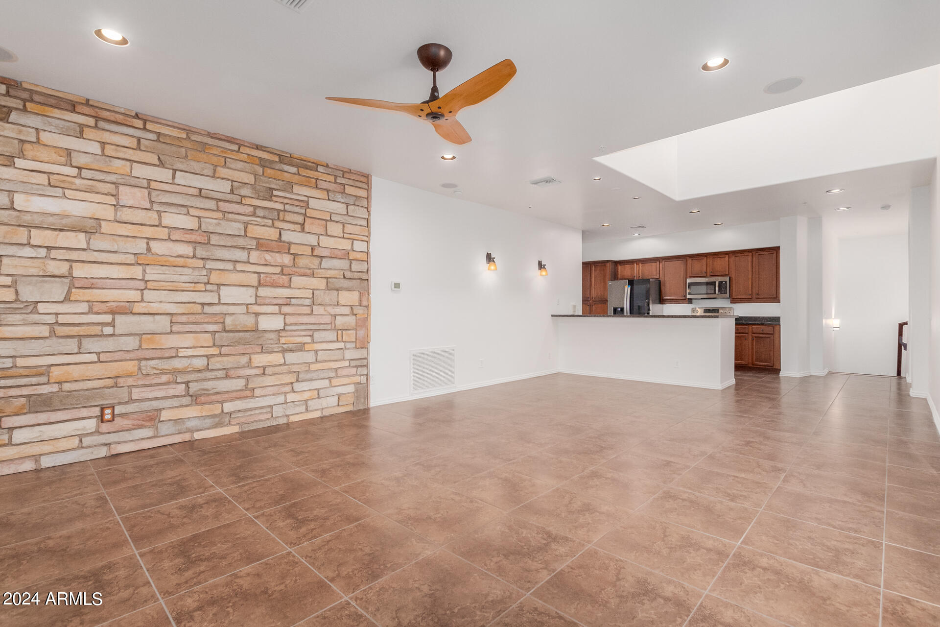3935 East Rough Rider Road, Unit 1246 Phoenix, AZ 85050 - Photo 8 of 54 a view of a kitchen with a sink and cabinets