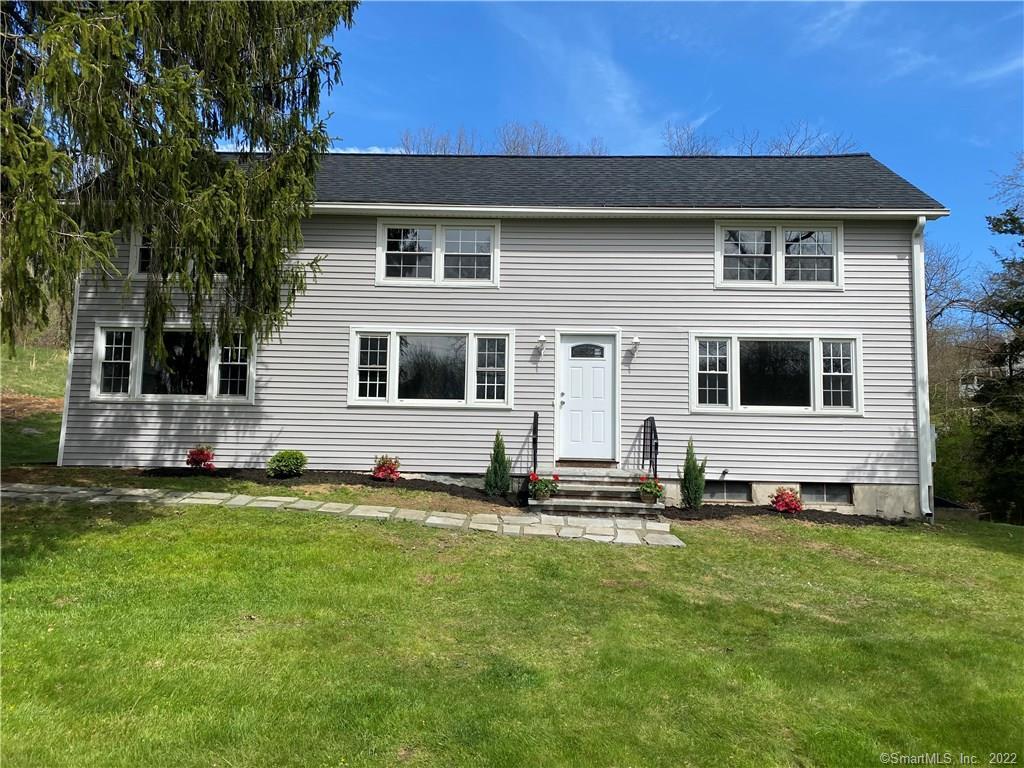 28 Pole Bridge Road Newtown, CT 06482 - Photo 1 of 1 a front view of a house with a yard