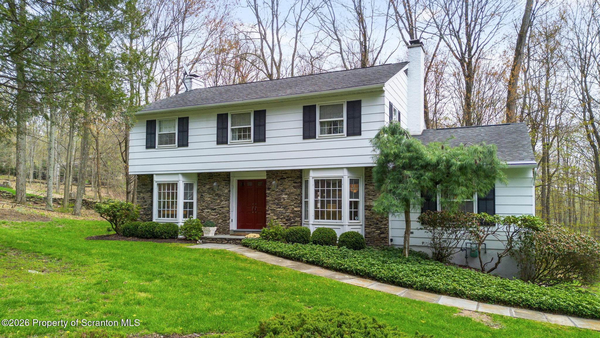 202 Woodlea Road Glenburn, PA 18414 - Photo 1 of 28 a view of a house with a yard and plants