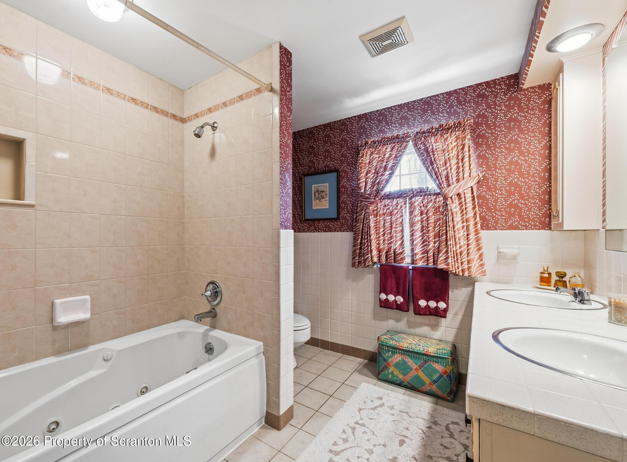 202 Woodlea Road Glenburn, PA 18414 - Photo 20 of 28 a bathroom with a sink toilet and shower