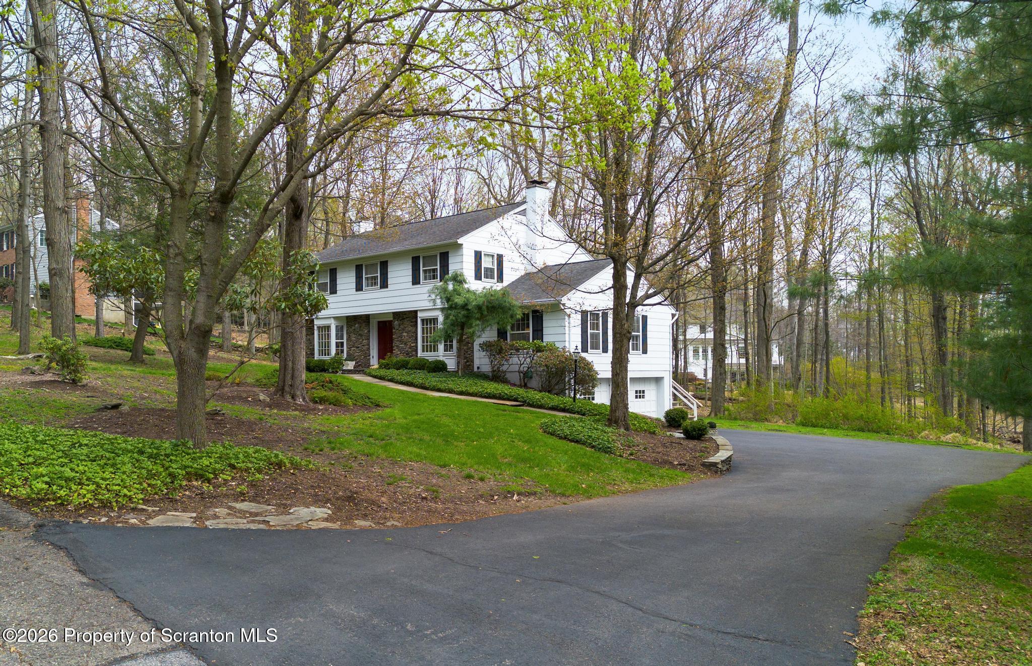 202 Woodlea Road Glenburn, PA 18414 - Photo 2 of 28 a view of a big house with large trees and plants