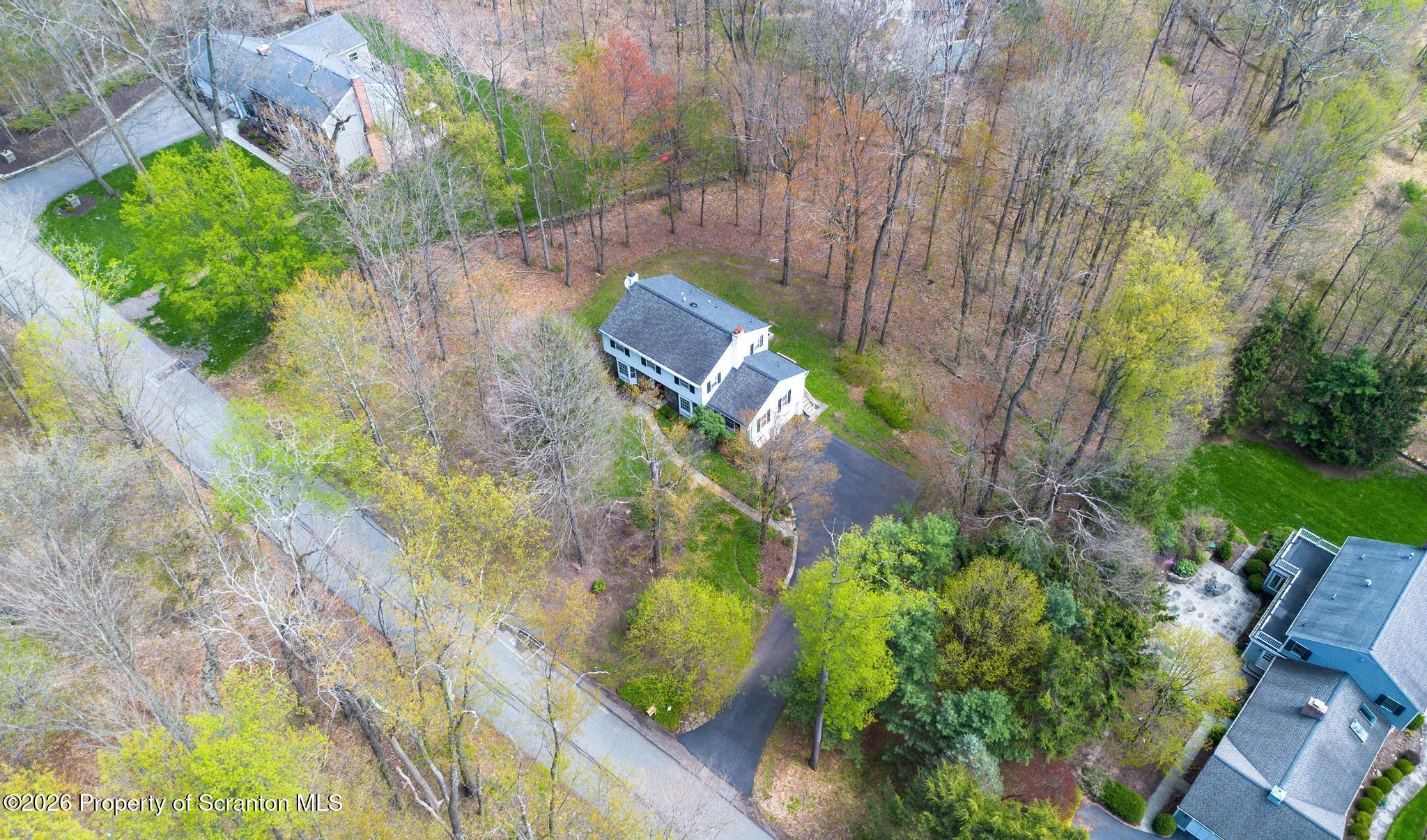 202 Woodlea Road Glenburn, PA 18414 - Photo 27 of 28 a backyard of a house with lots of green space