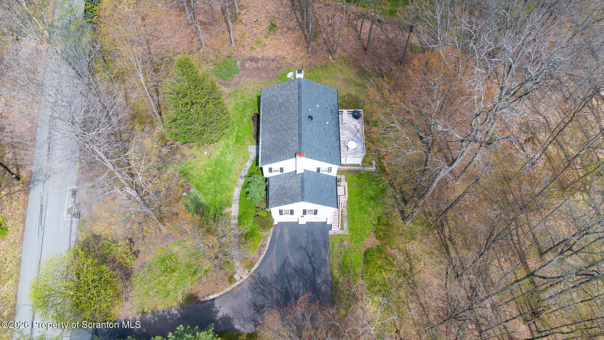 202 Woodlea Road Glenburn, PA 18414 - Photo 28 of 28 an aerial view of a house with an outdoor space
