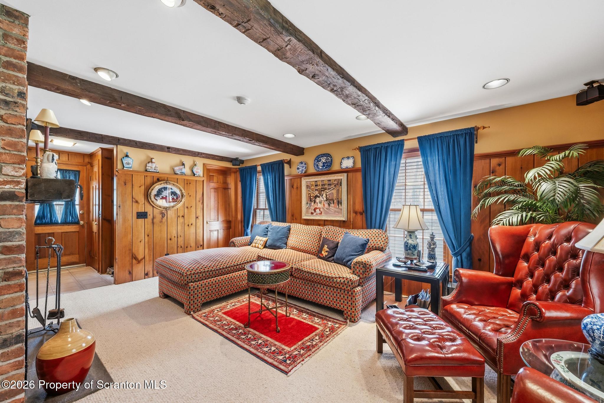 202 Woodlea Road Glenburn, PA 18414 - Photo 8 of 28 a living room with furniture a rug and a large window