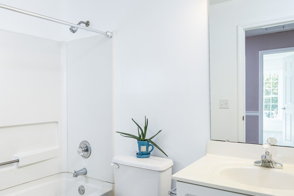 12212 Amoretto Way Raleigh, NC 27613 - Photo 22 of 30 Immaculate and ready for your personal touch with the same durable and beautiful LVP as downstairs! Hall Bath
