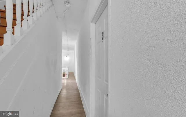 a bathroom with a sink a toilet a mirror and shower curtain