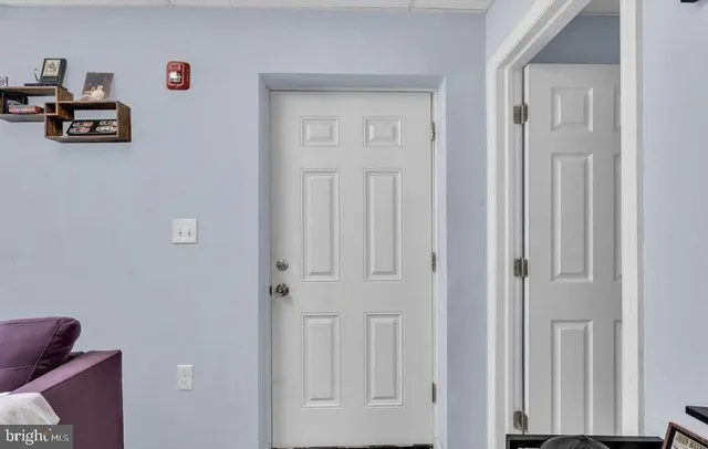 a view of an entryway with livingroom