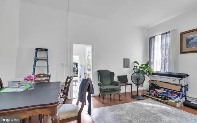 a view of a dining room with furniture and a potted plants