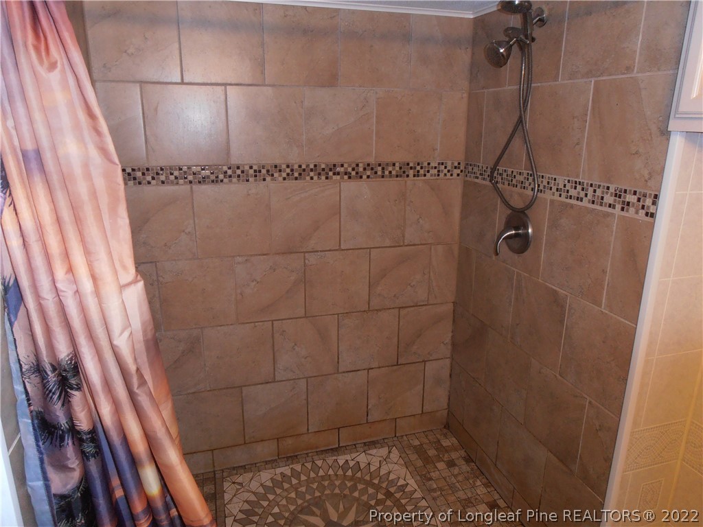 73 Hollywood Road Cameron, NC 28326 - Photo 8 of 16 a bathroom with a shower