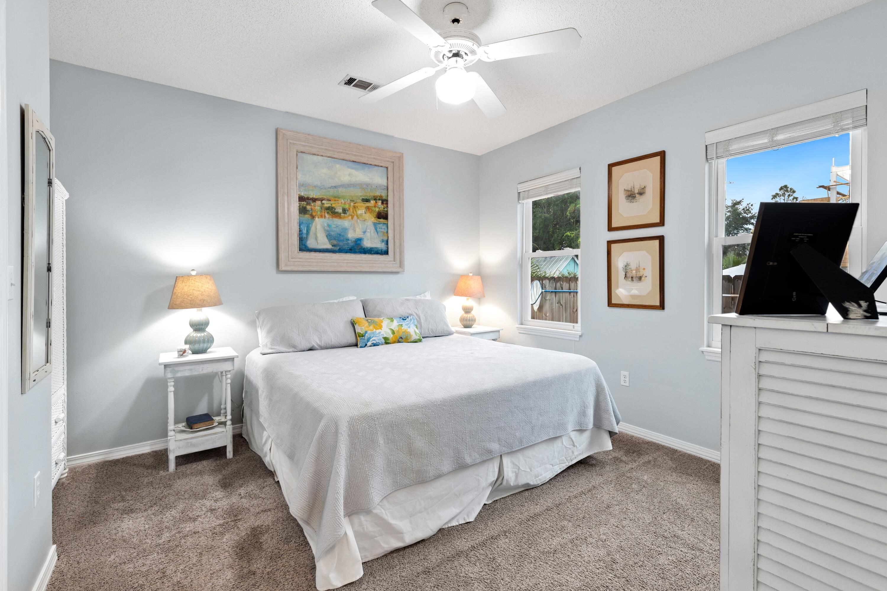 57 Pelayo Avenue Santa Rosa Beach, FL 32459 - Photo 12 of 43 a bedroom with a bed and a flat screen tv