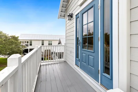 a view of balcony with wooden floor