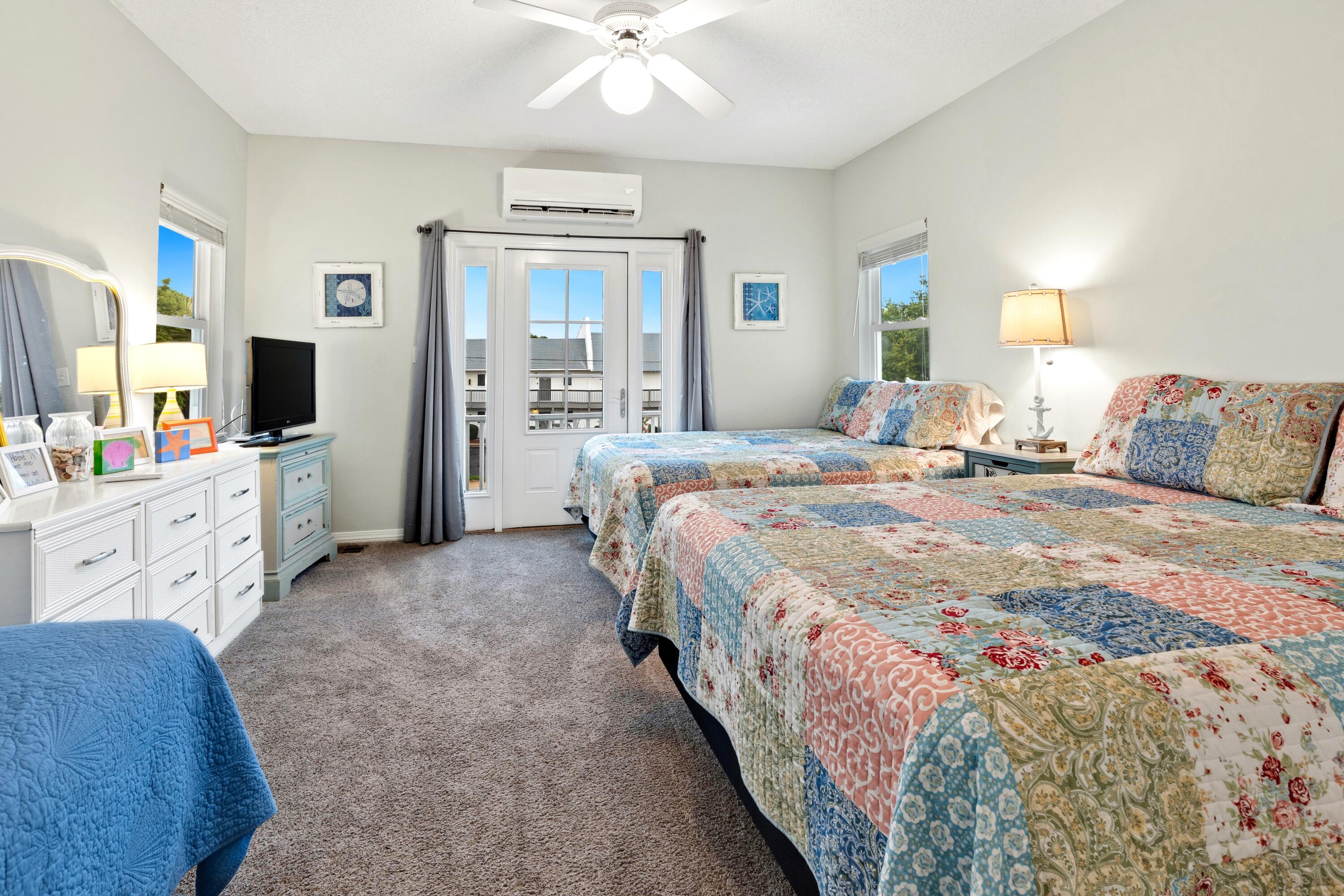 57 Pelayo Avenue Santa Rosa Beach, FL 32459 - Photo 14 of 43 a spacious bedroom with a bed a couch and dresser