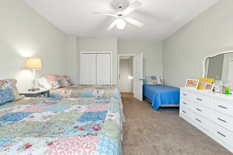 a bedroom with a bed and a dresser