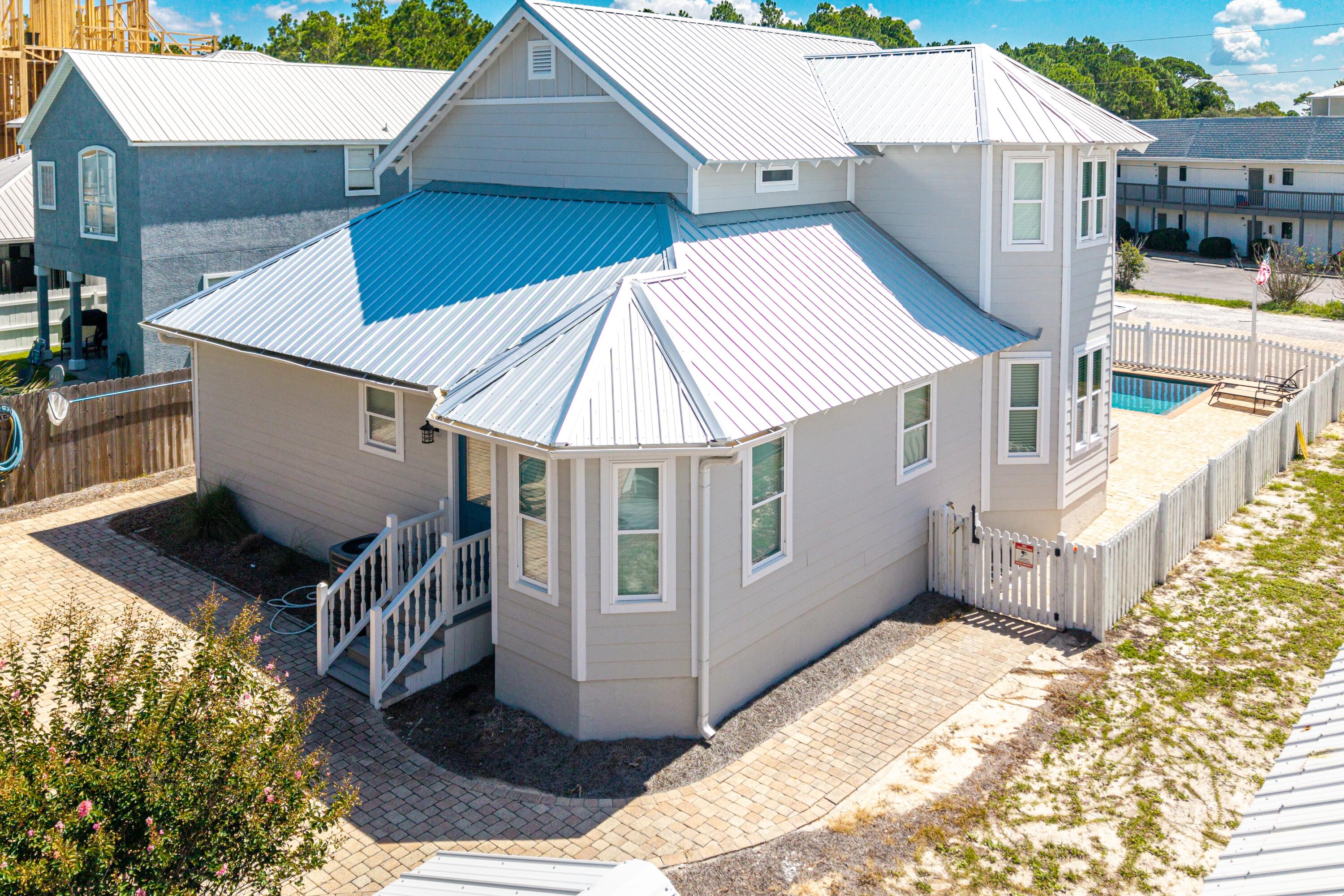 57 Pelayo Avenue Santa Rosa Beach, FL 32459 - Photo 26 of 43 a view of a house with a wooden deck