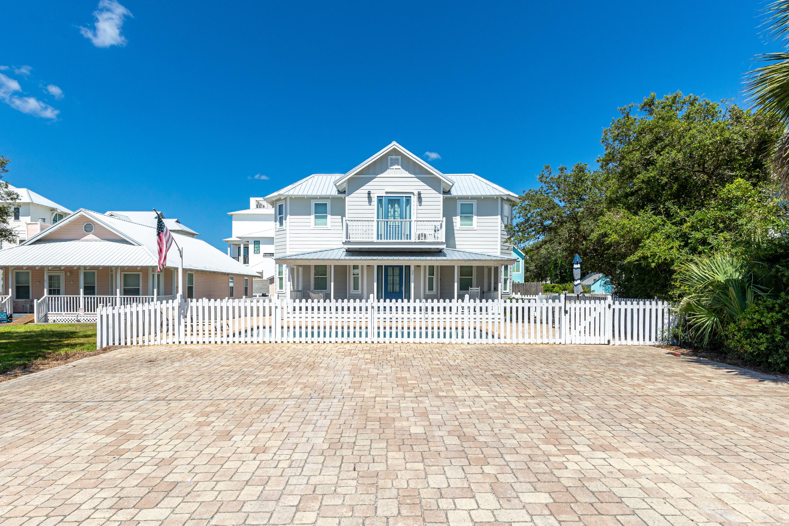 57 Pelayo Avenue Santa Rosa Beach, FL 32459 - Photo 30 of 43 a front view of a house with a yard