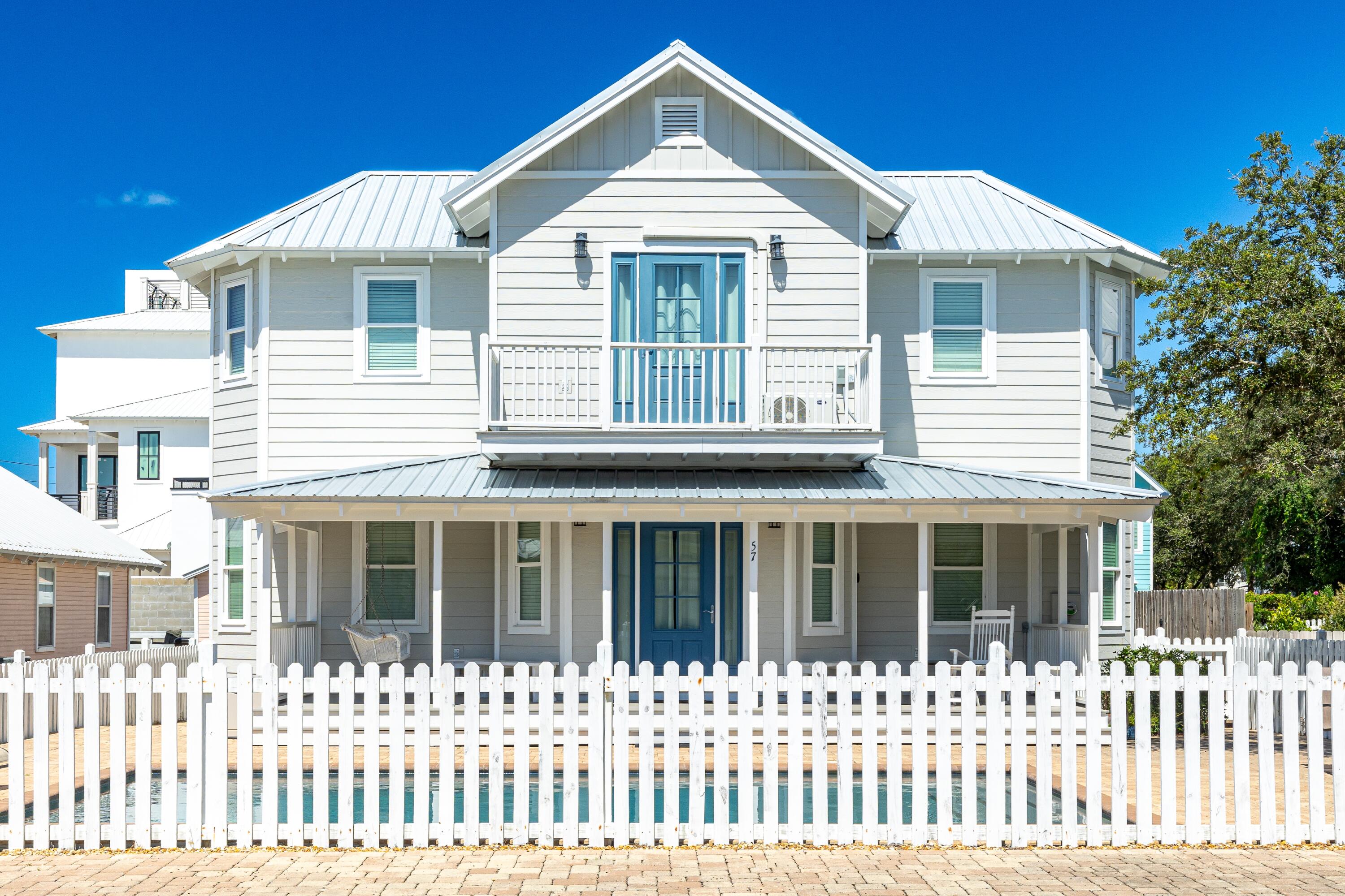 57 Pelayo Avenue Santa Rosa Beach, FL 32459 - Photo 33 of 43 a front view of a white house with a small yard