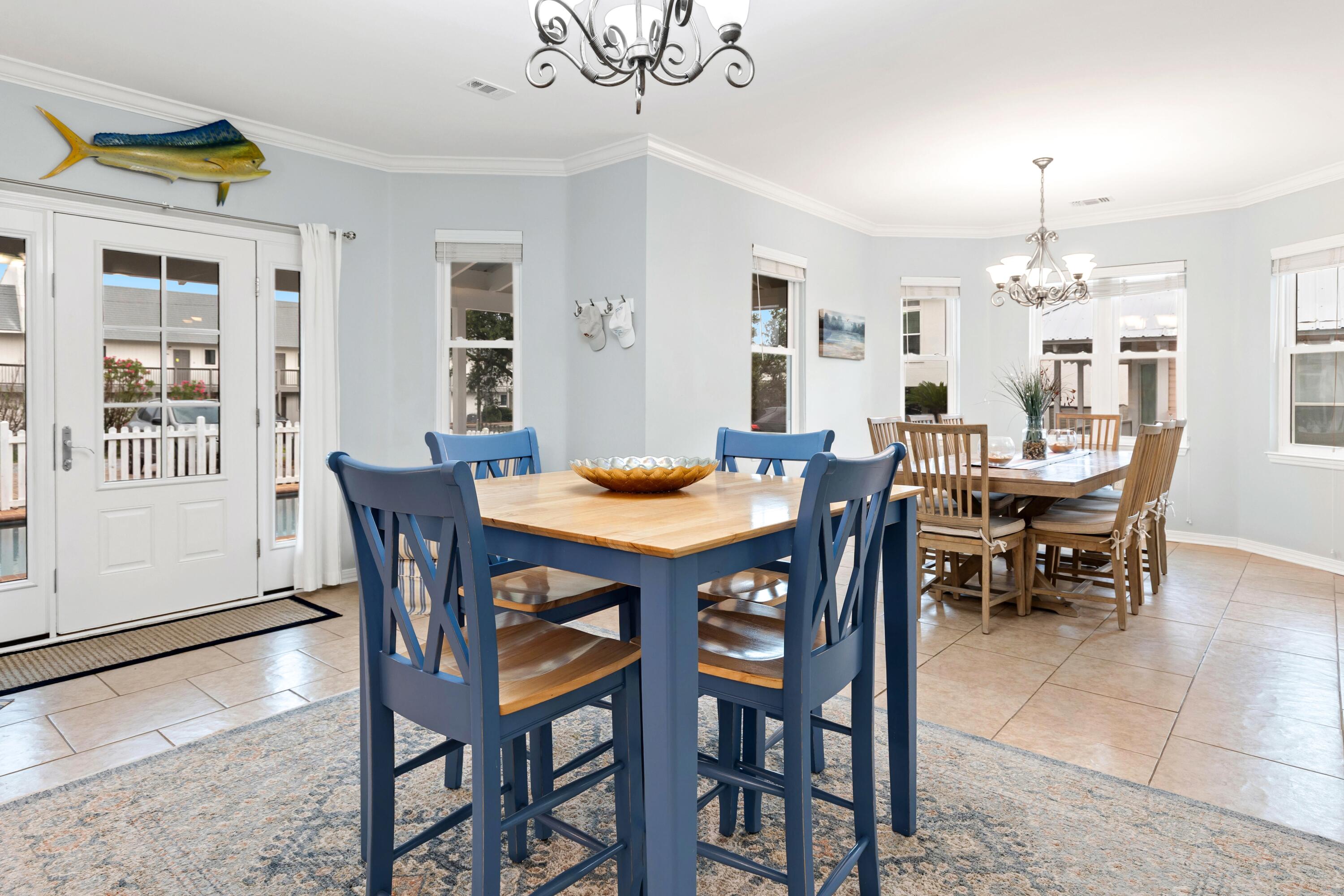 57 Pelayo Avenue Santa Rosa Beach, FL 32459 - Photo 8 of 43 a dining room with furniture a chandelier and wooden floor