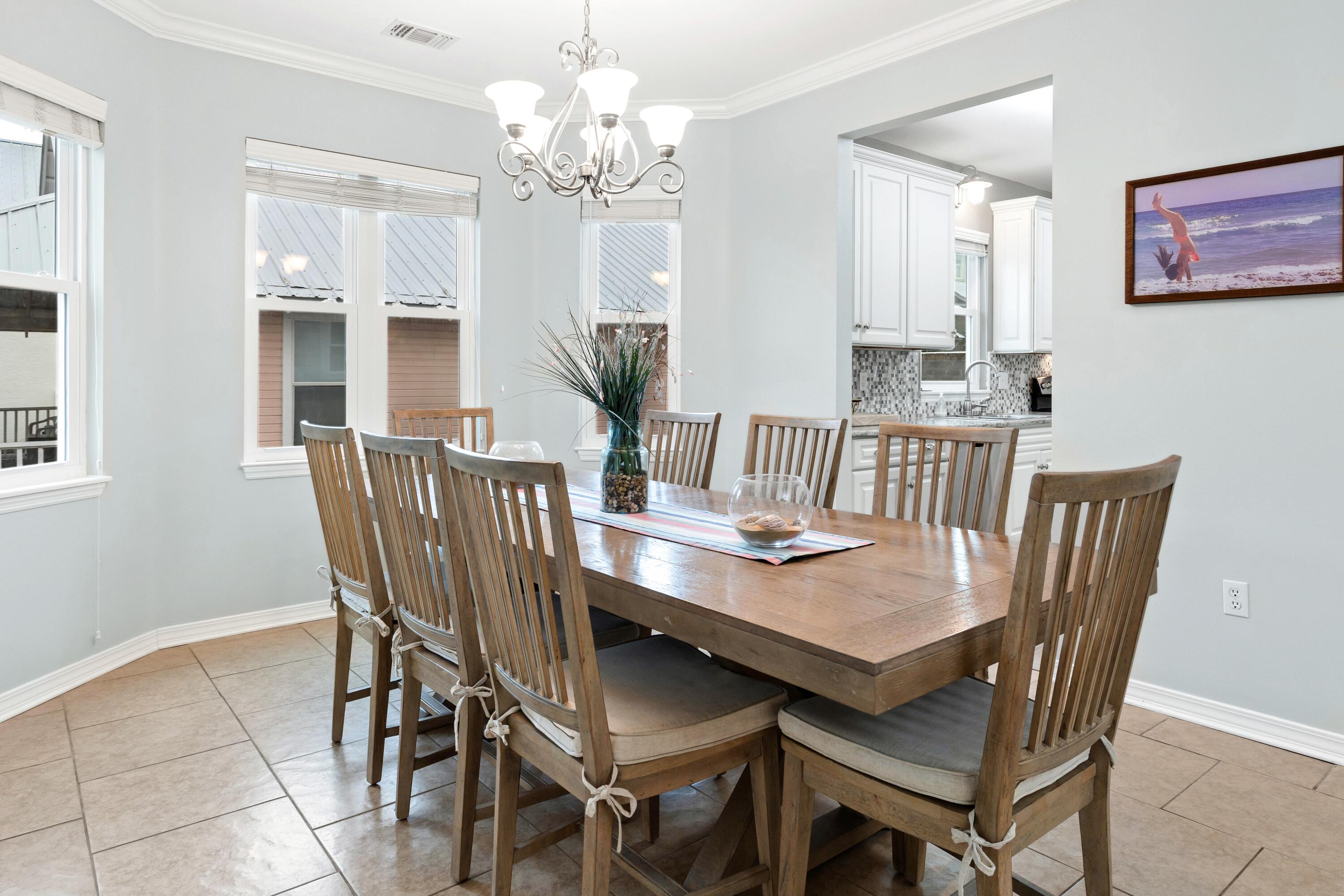 57 Pelayo Avenue Santa Rosa Beach, FL 32459 - Photo 9 of 43 a view of a dining room with furniture and chandelier