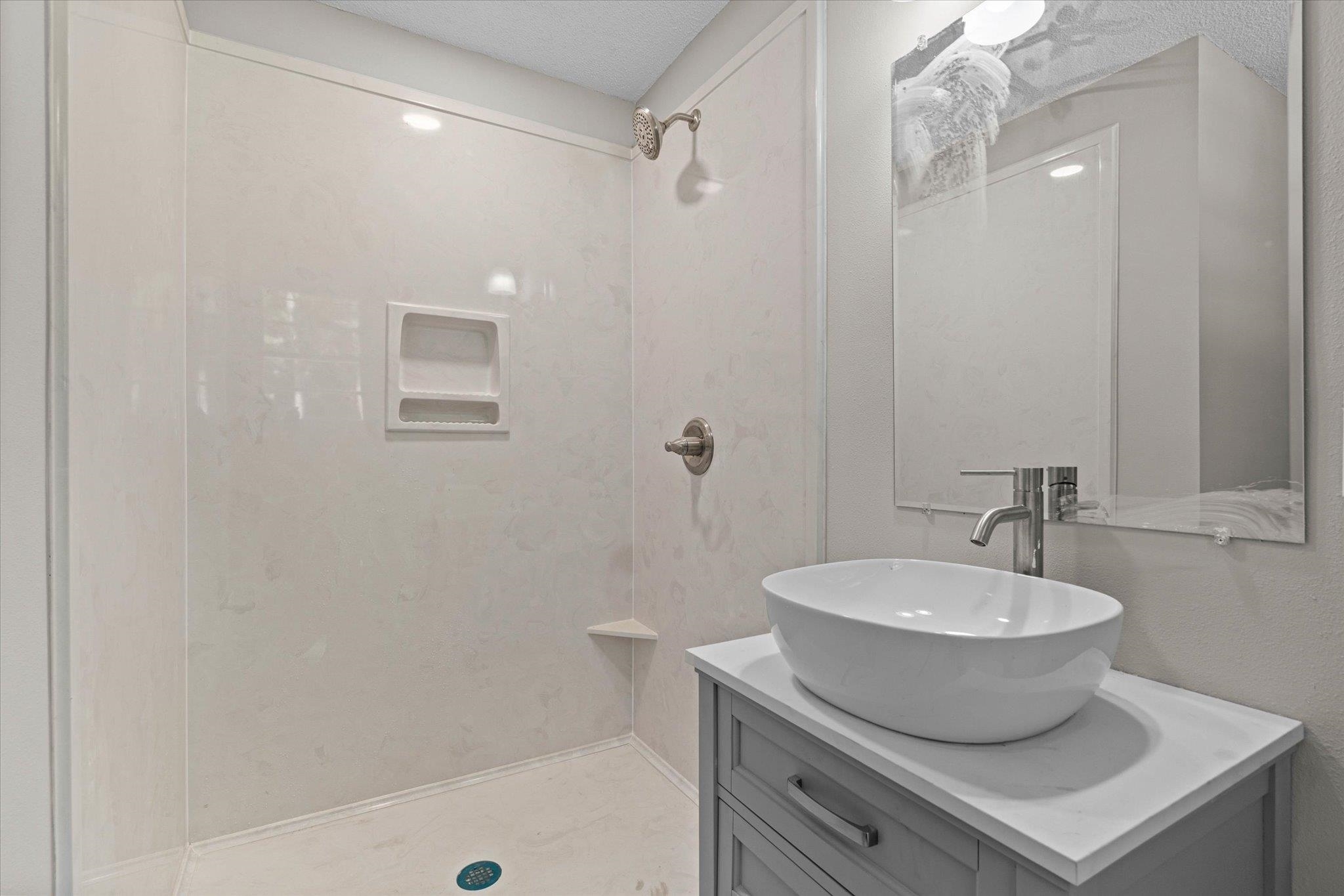 4700 Bit And Spur Road Mobile, AL 36608 - Photo 12 of 21 Full bath with vanity and a shower