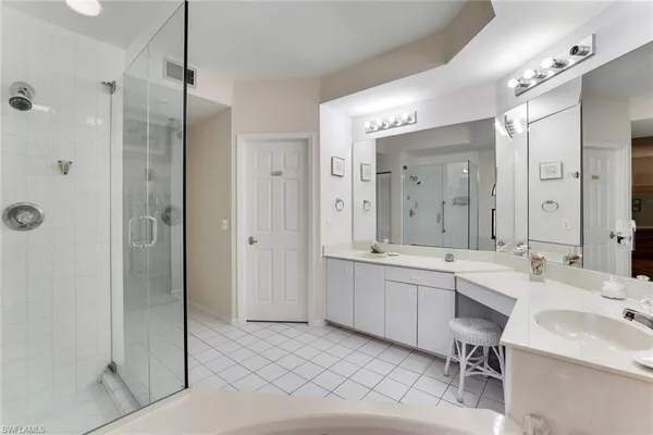 a bedroom with 2 bed and a window