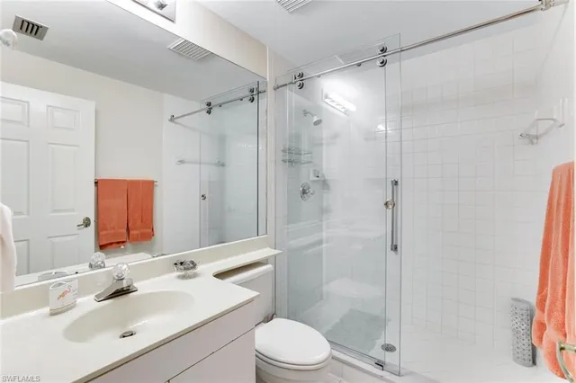 a living room with furniture and a lamp