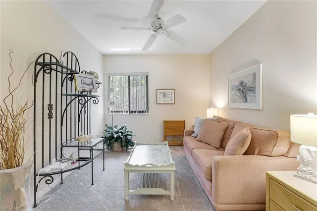 a balcony with furniture and a potted plant