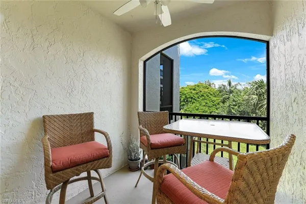 a swimming pool with outdoor seating and yard