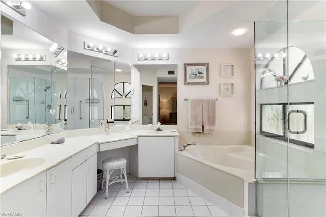 a bathroom with a double vanity sink mirror and double