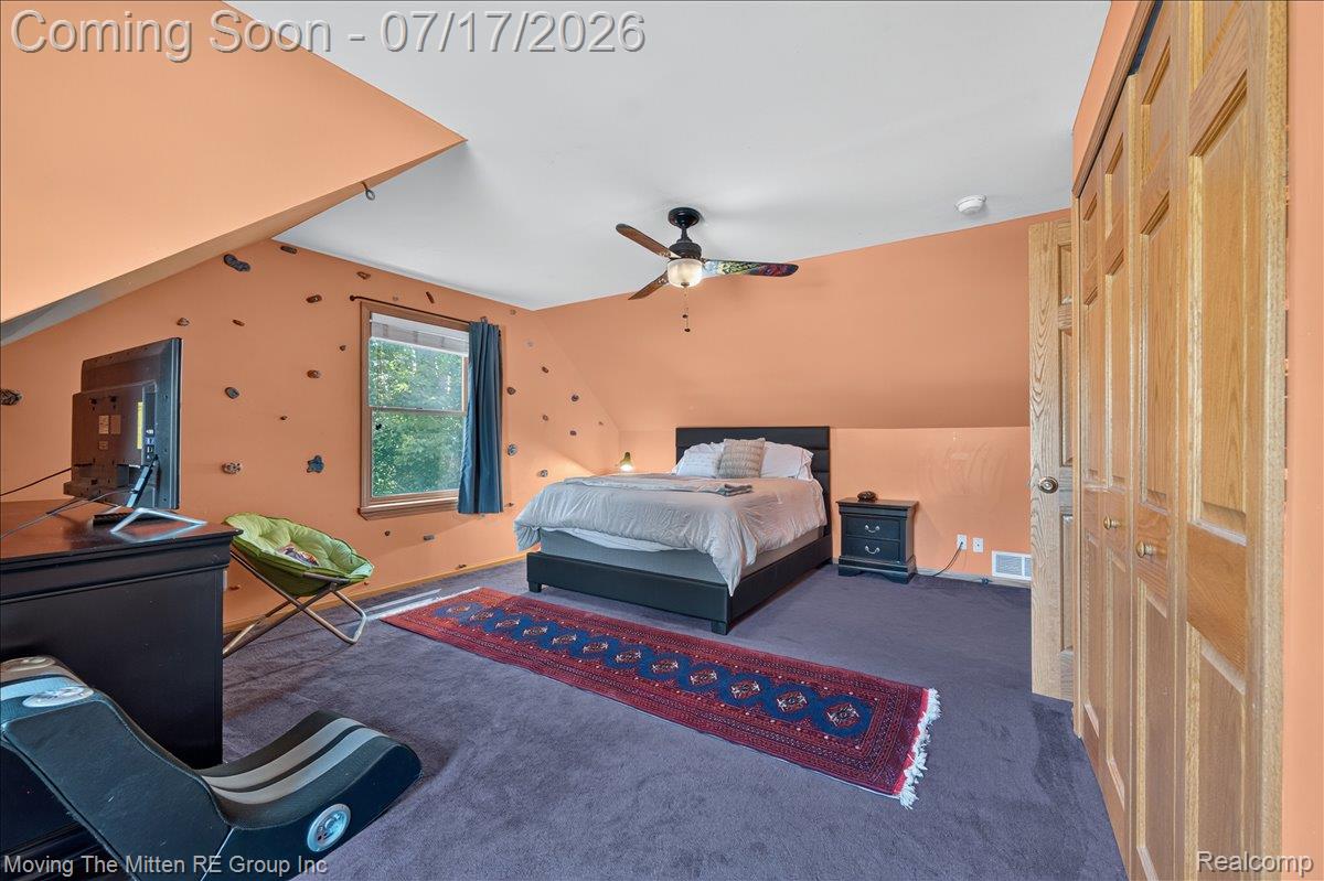 40162 Alden Road Belleville, MI 48111 - Photo 31 of 67 Carpeted room featuring a ceiling fan, a single window, and a built-in closet with natural wood doors