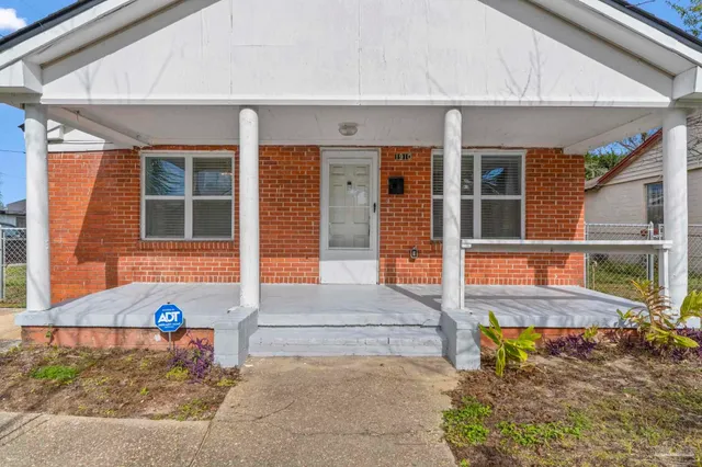 front view of a house with a large window