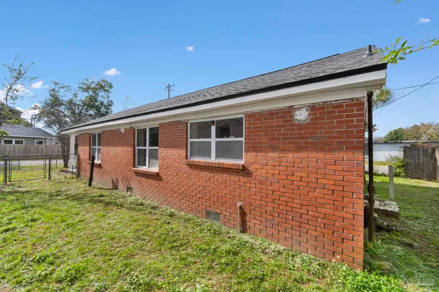 a backyard of a house with lots of green space