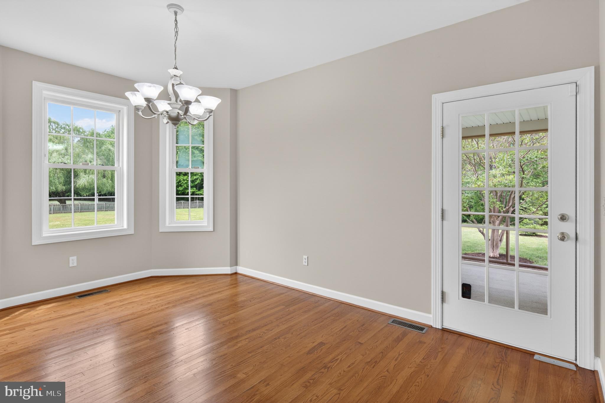 337 Roe Ingleside Road Centreville, MD 21617 - Photo 31 of 56 a view of an empty room with wooden floor and a window