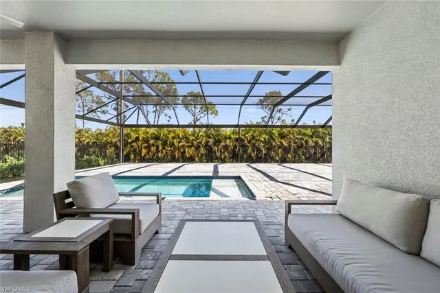 a view of sitting area with furniture and wooden floor