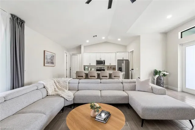 a living room with furniture and a rug