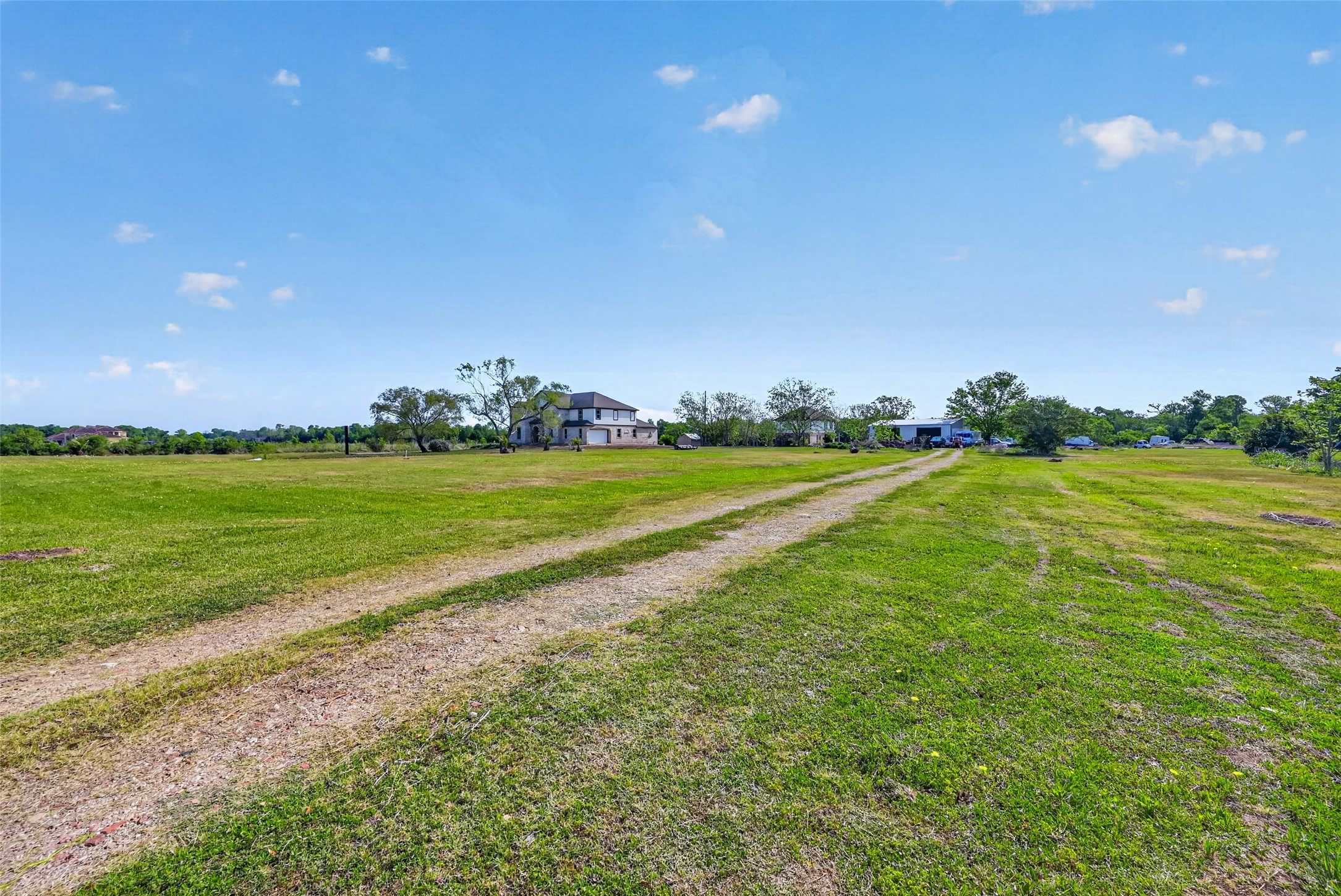 8023 Pool Hill Road Fulshear, TX 77441 - Photo 45 of 50 a view of a golf course with a lake