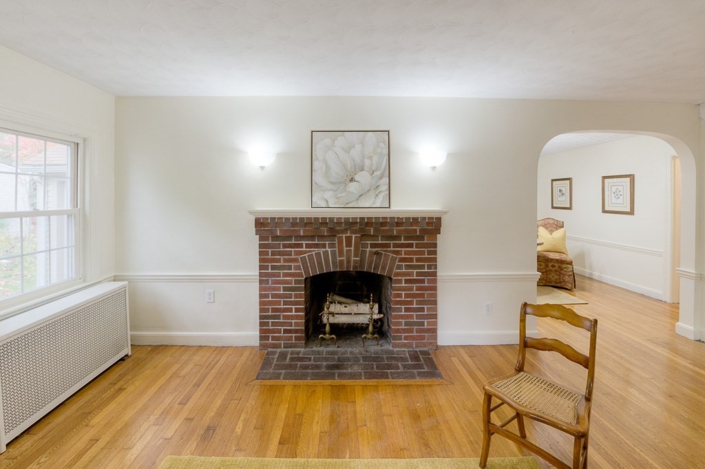 13 Westbrook Road Worcester, MA 01602 - Photo 12 of 41 a living room with a fireplace and windows