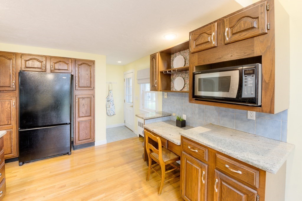 13 Westbrook Road Worcester, MA 01602 - Photo 22 of 41 a kitchen with stainless steel appliances granite countertop a refrigerator and a stove top oven